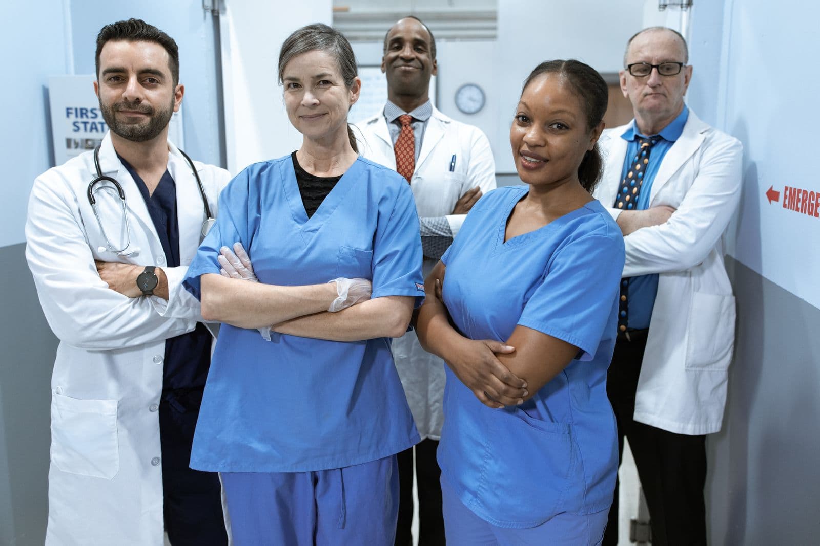 A diverse clinical team standing together in a clinic